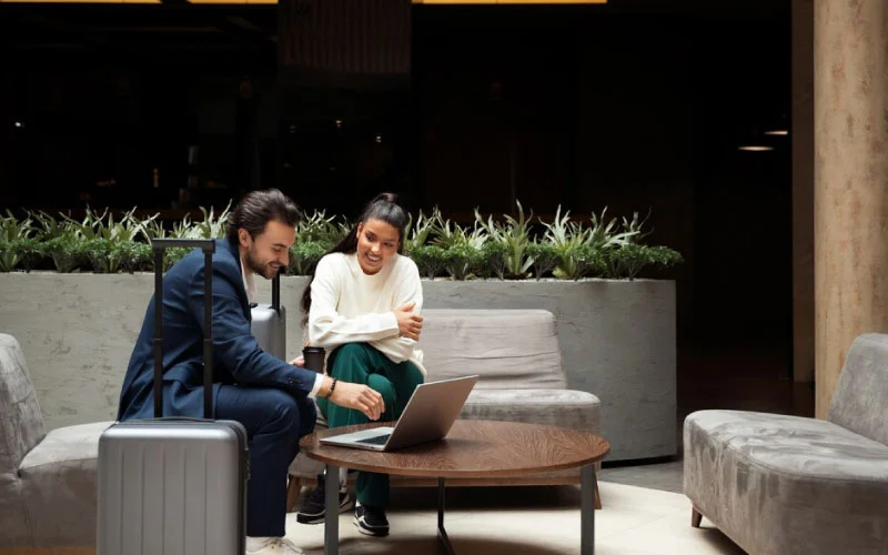 Corporate group boarding a modern coach fitted with onboard Wi-Fi and comfortable seating in central London.