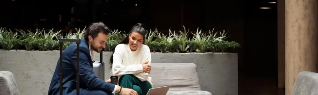 Corporate group boarding a modern coach fitted with onboard Wi-Fi and comfortable seating in central London. Corporate Coach Hire London